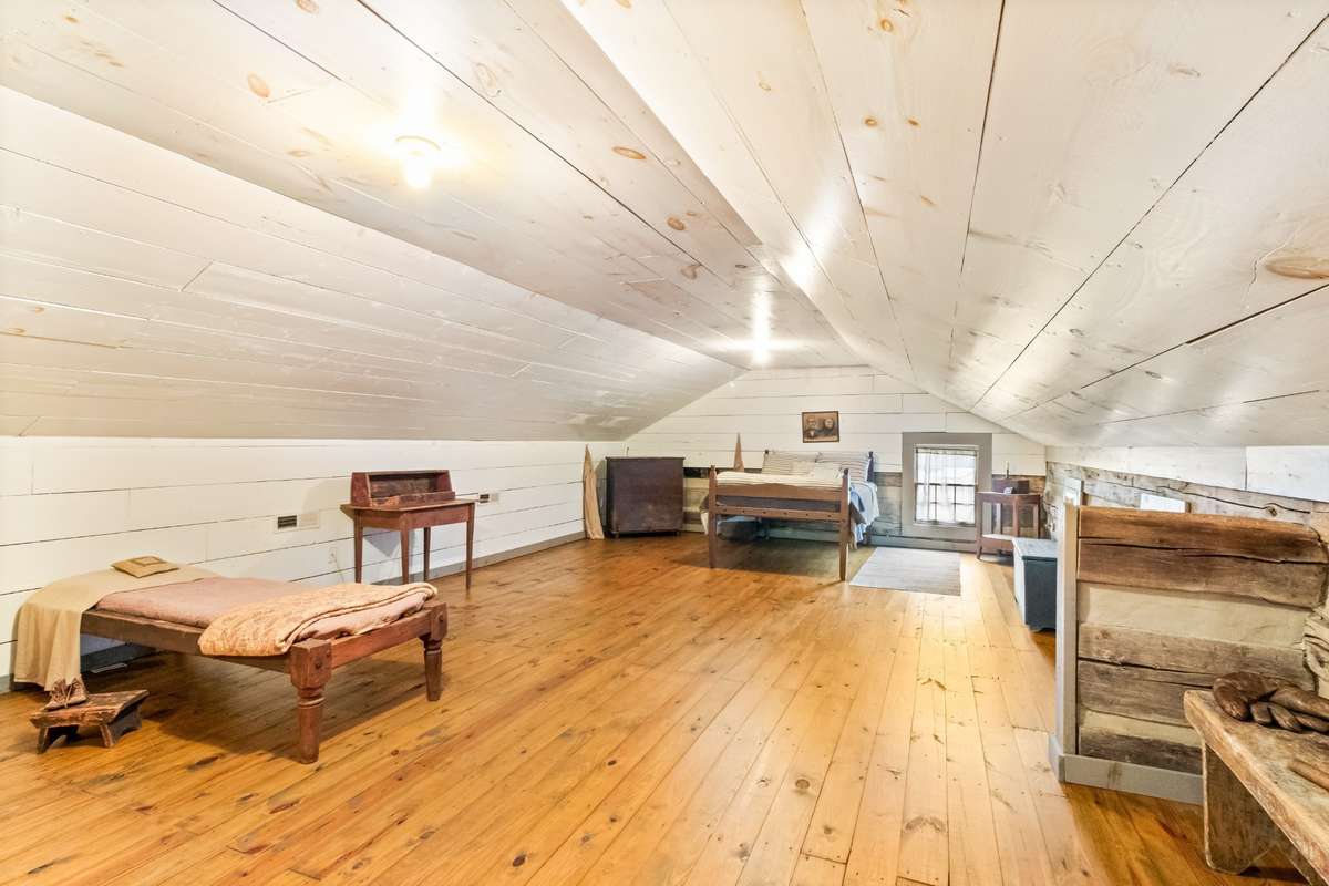 The bedrooms upstairs are open to each other and divided by the steps.