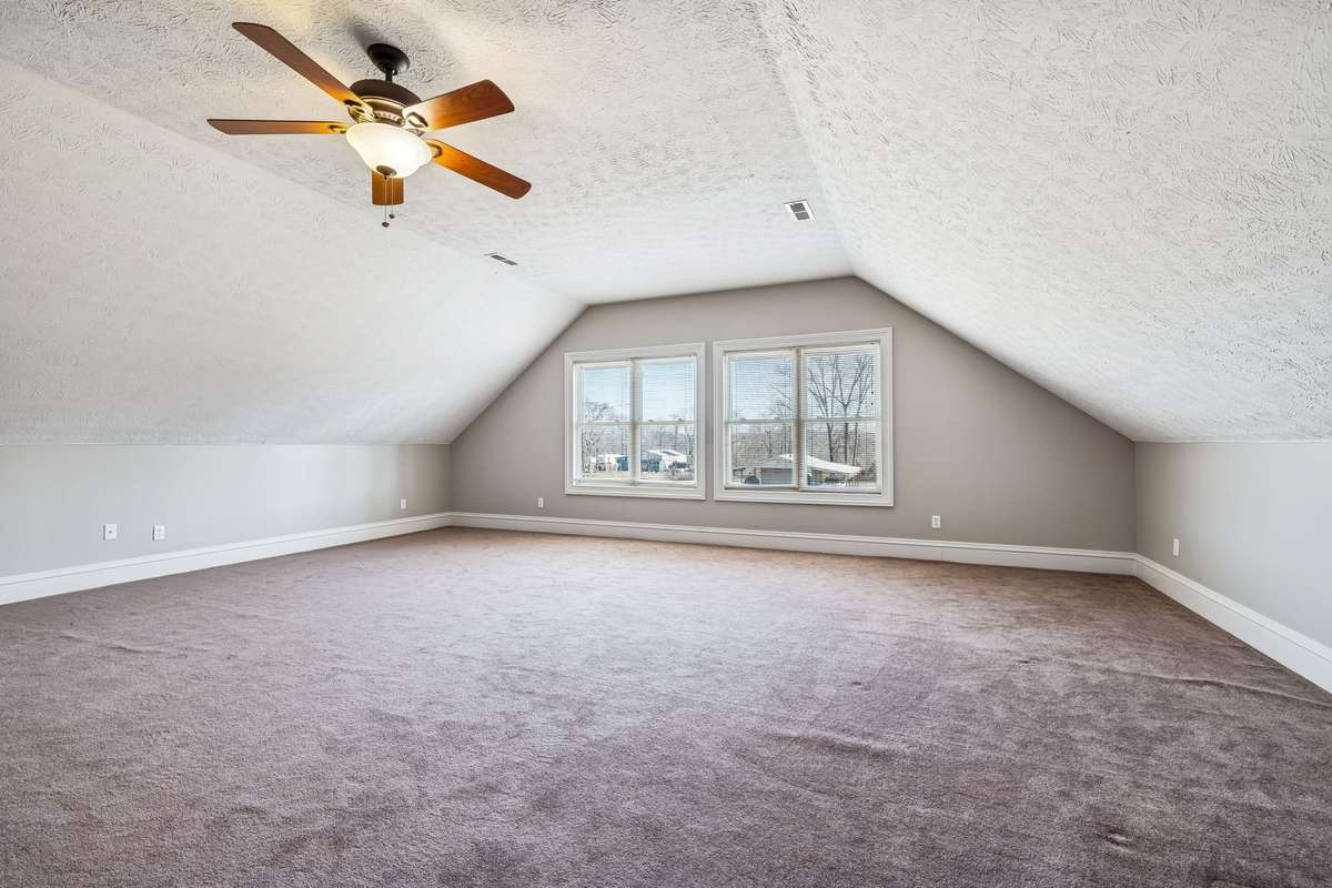 Escape, Enjoy, Create! This space is just wishing for a large sectional, Big Flat Screen and dark drapes
