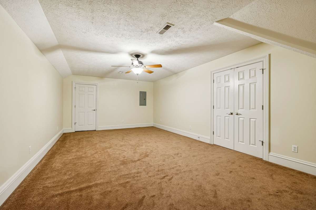 One more room upstairs, with very large walk-in closet and access to attic. Could be a bedroom or ???