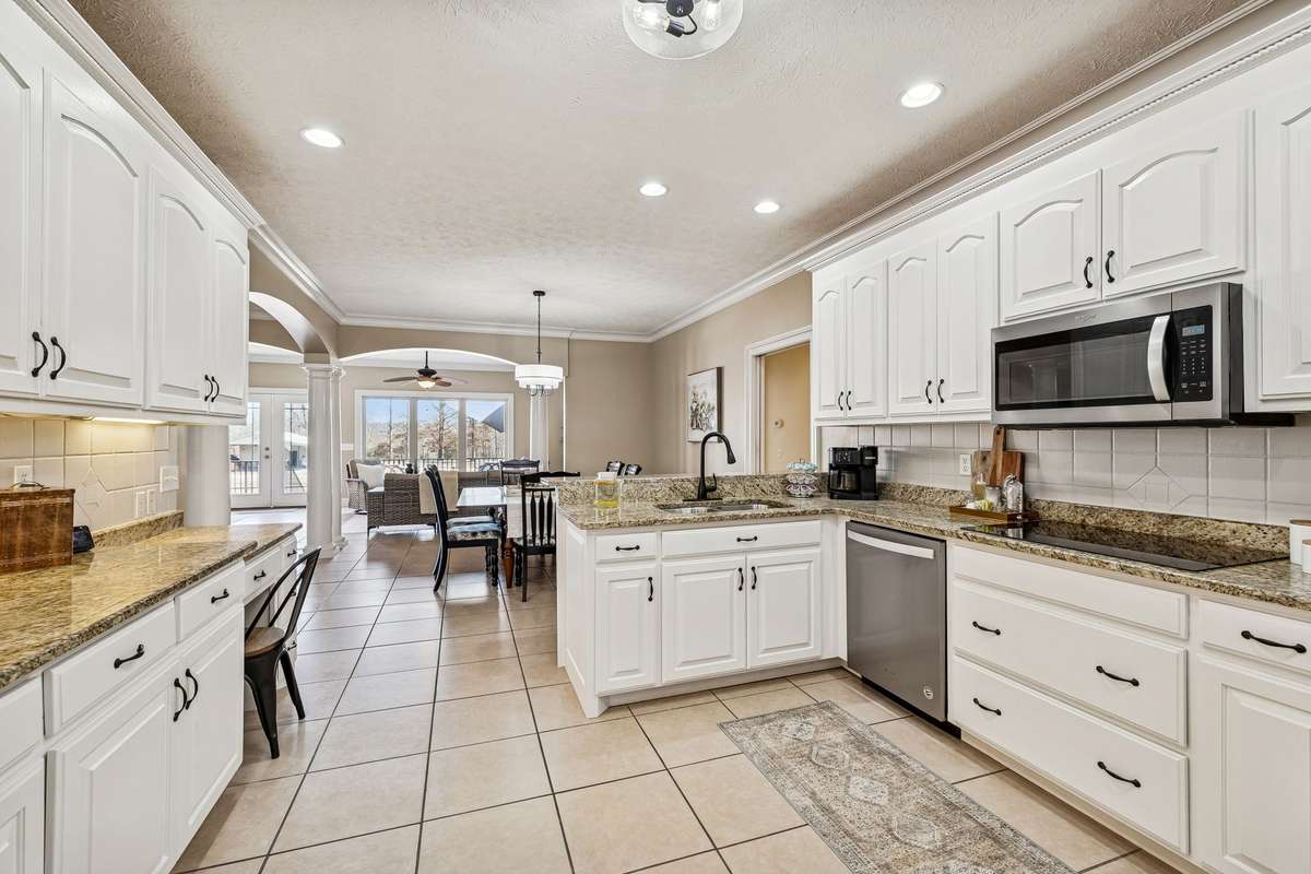 Updated Kitchen with granite, tile floors, and new lighting!