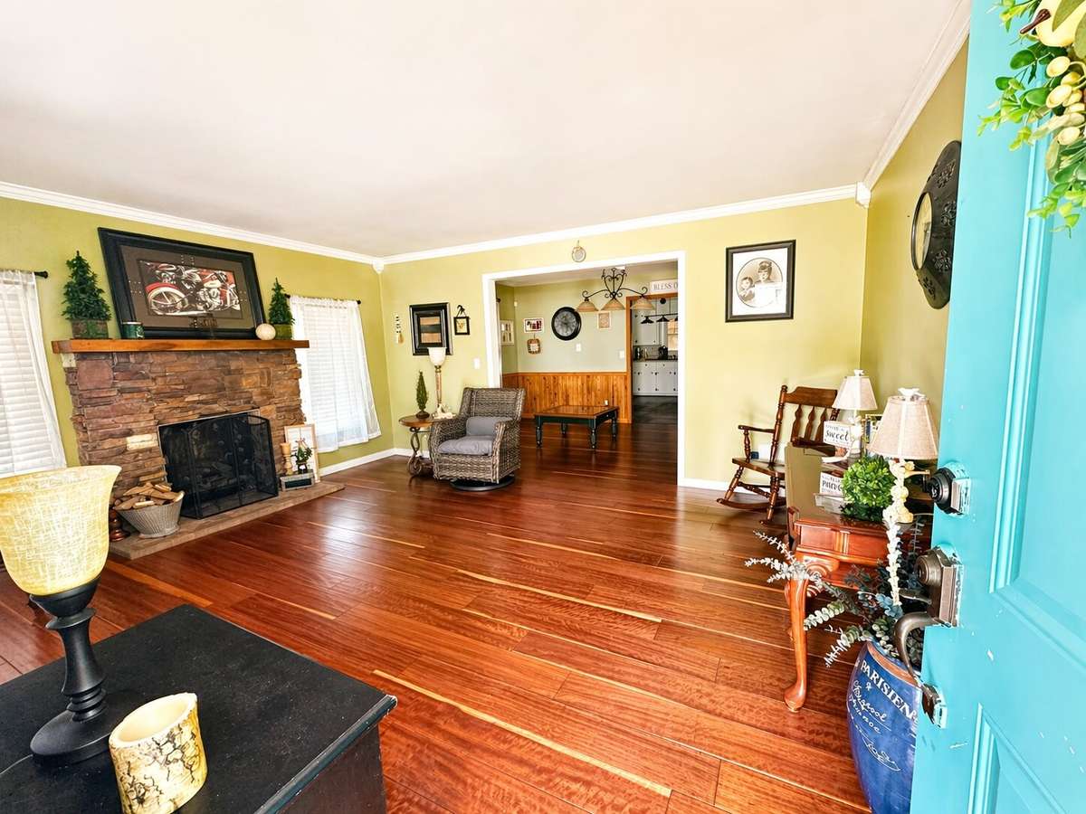 LR with a large opening to DR and kitchen giving an appearance of an open floor plan