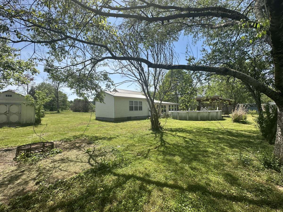 Check out this view from the back lawn showing the outbuilding
