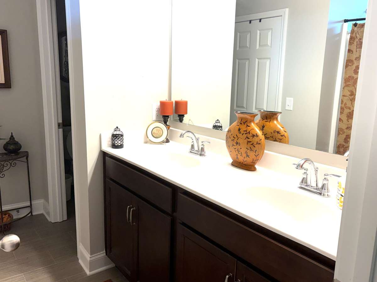 Primary Bath has roomy linen closet and large walk-in closet