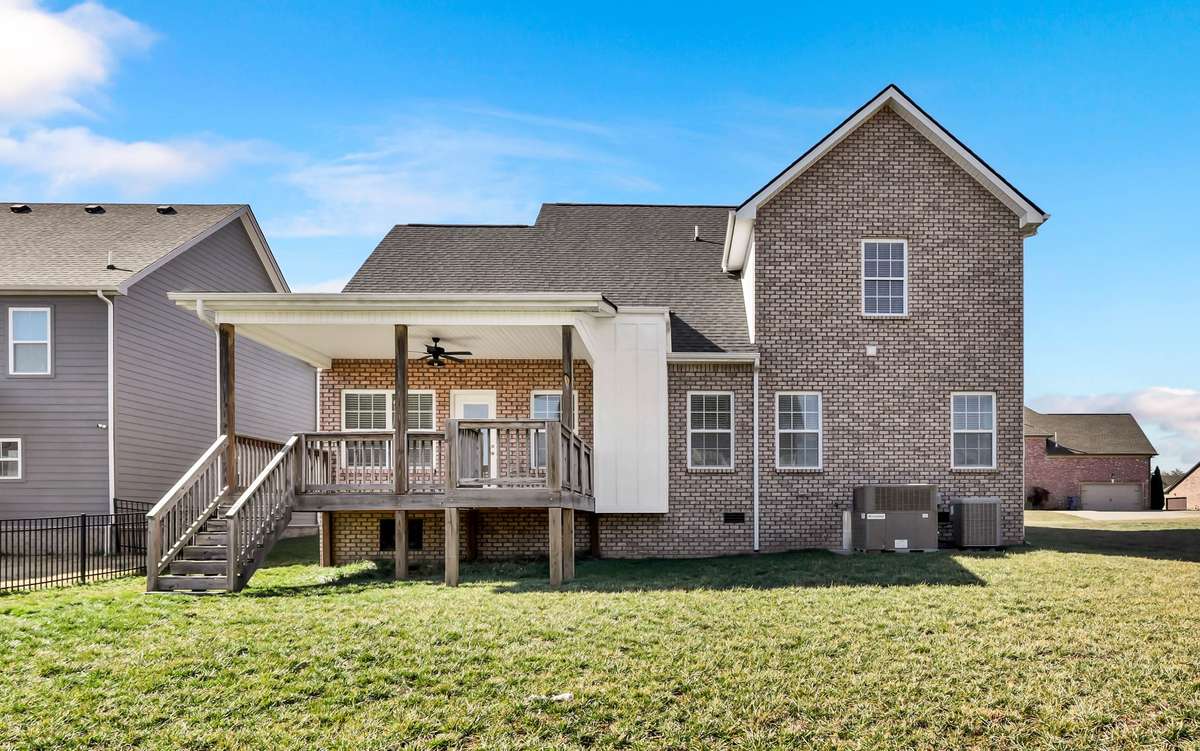 The home is mostly brick with a few hardboard accents.