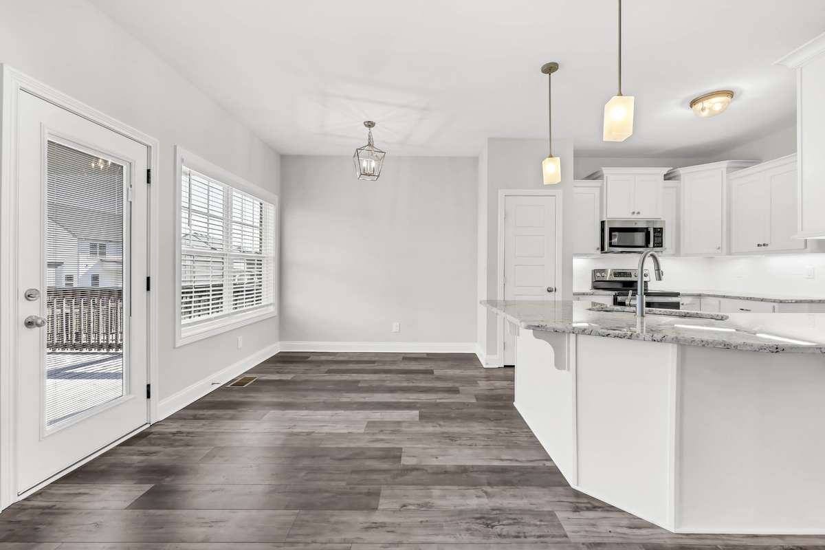 Whether enjoying a quiet morning coffee or hosting dinner with friends, this dining area is both functional and welcoming.