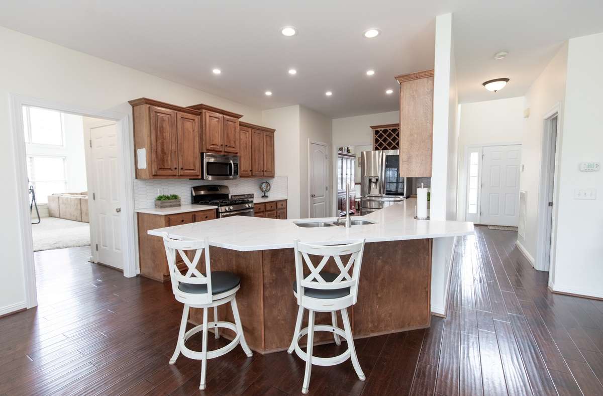 Island opens to den/living area and breakfast nook. Plenty of room for 4-5 stools!