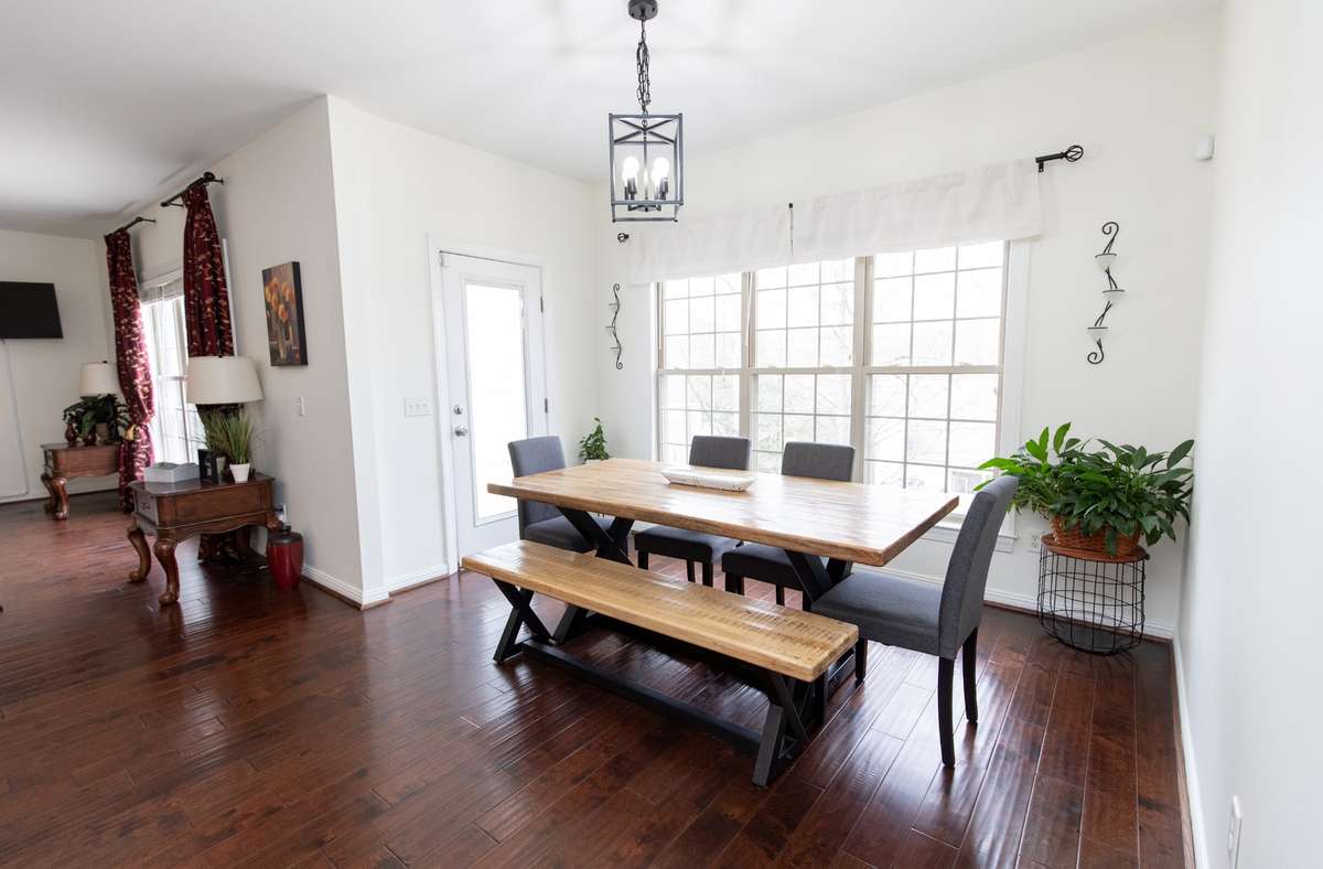 Breakfast nook by these huge windows- perfect for morning coffee. Opens to den/living room
