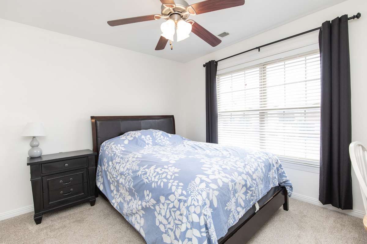 Bedroom 2 upstairs with large closet and full bath directly across the hall. No need to share the bathroom because all the other bedrooms have an ensuite bath!