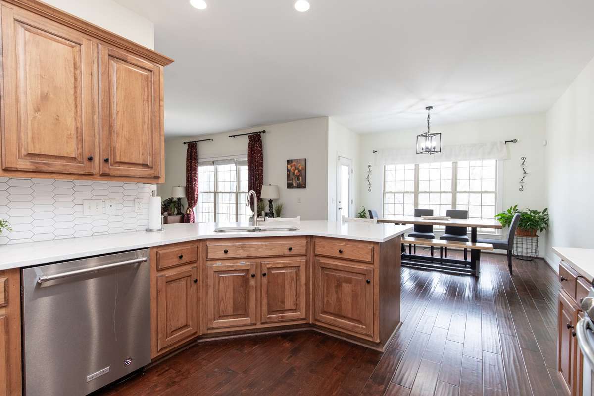 Massive kitchen is everyone's dream! Plenty of counter space and cabinets! Look at all that natural light coming through!