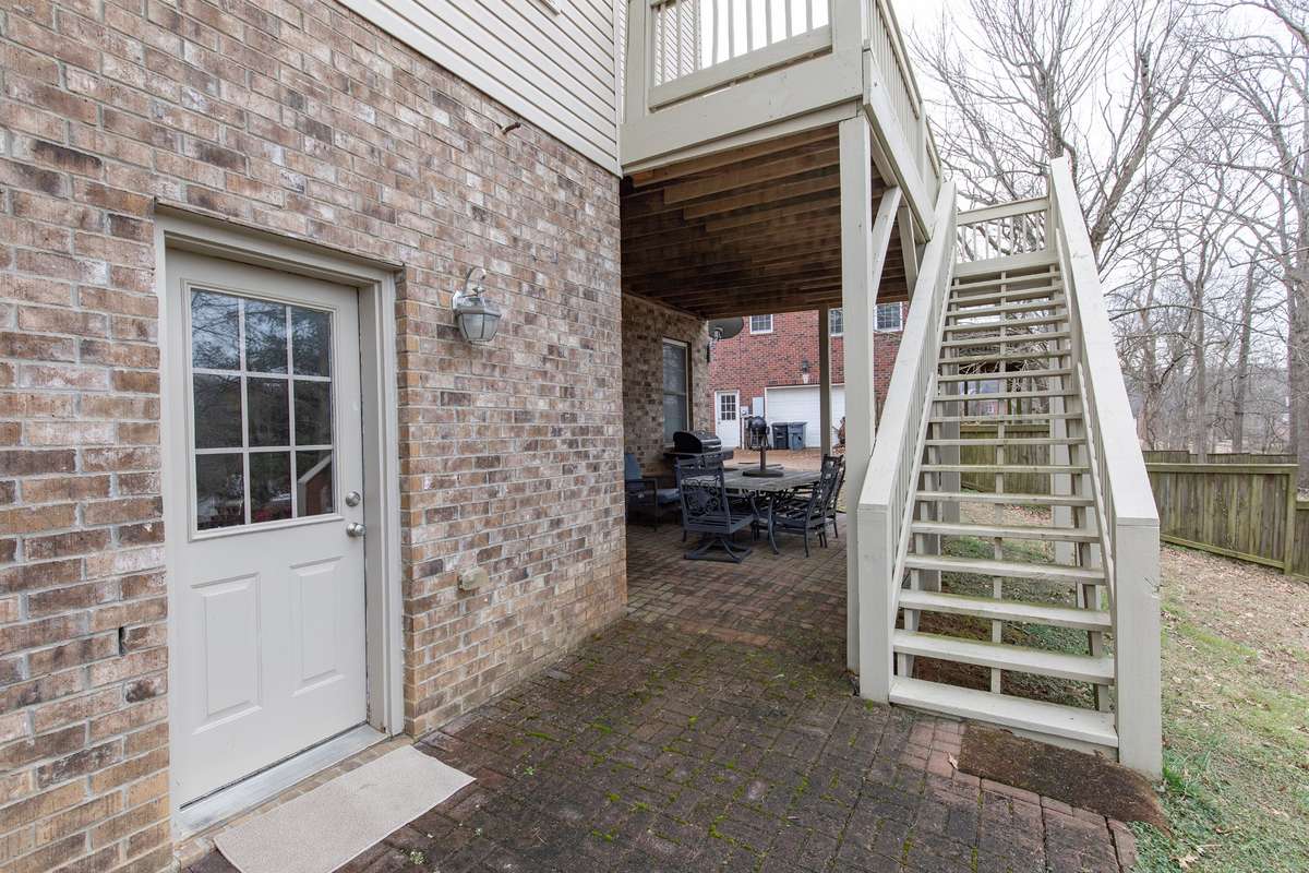 Door to basement area.....can enjoy a separate private patio under the deck. Perfect for morning coffee or getting some shade in the summer.