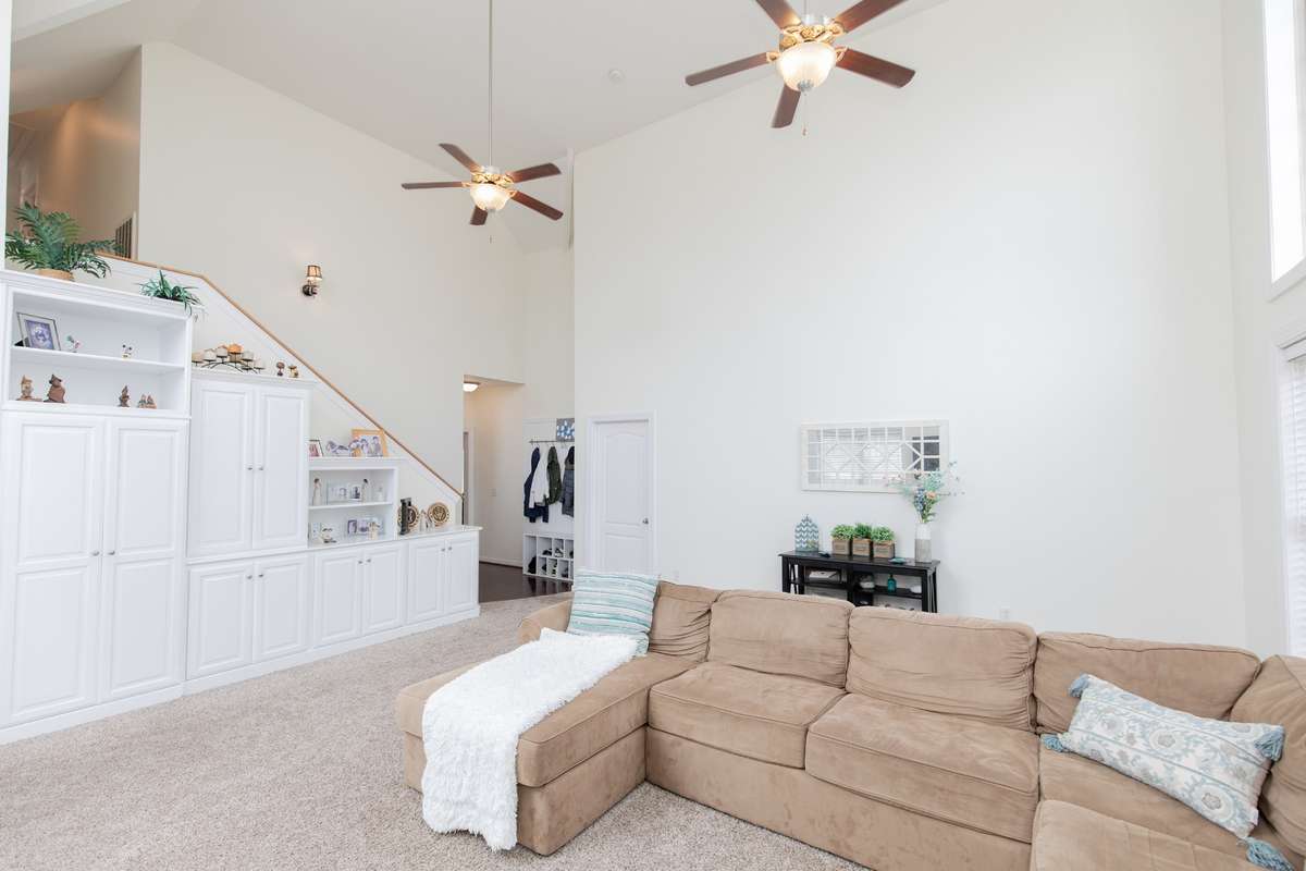 Primary bedroom right off this room. Stairs lead up to 3 more bedrooms each with their own FULL bath.