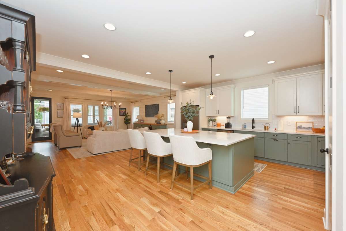 Open kitchen with custom cabinets and huge island