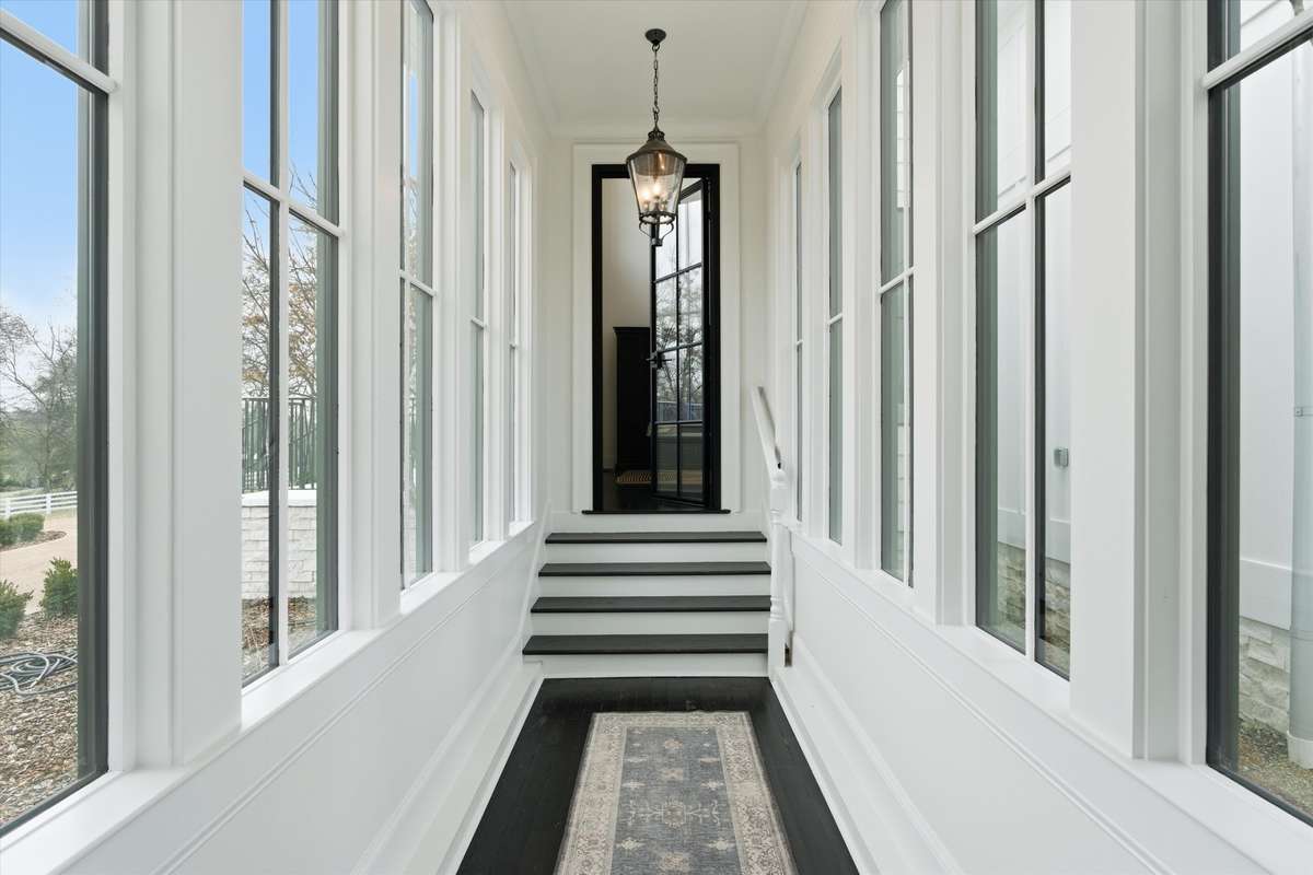 Hallway from main entrance to bonus area and garage