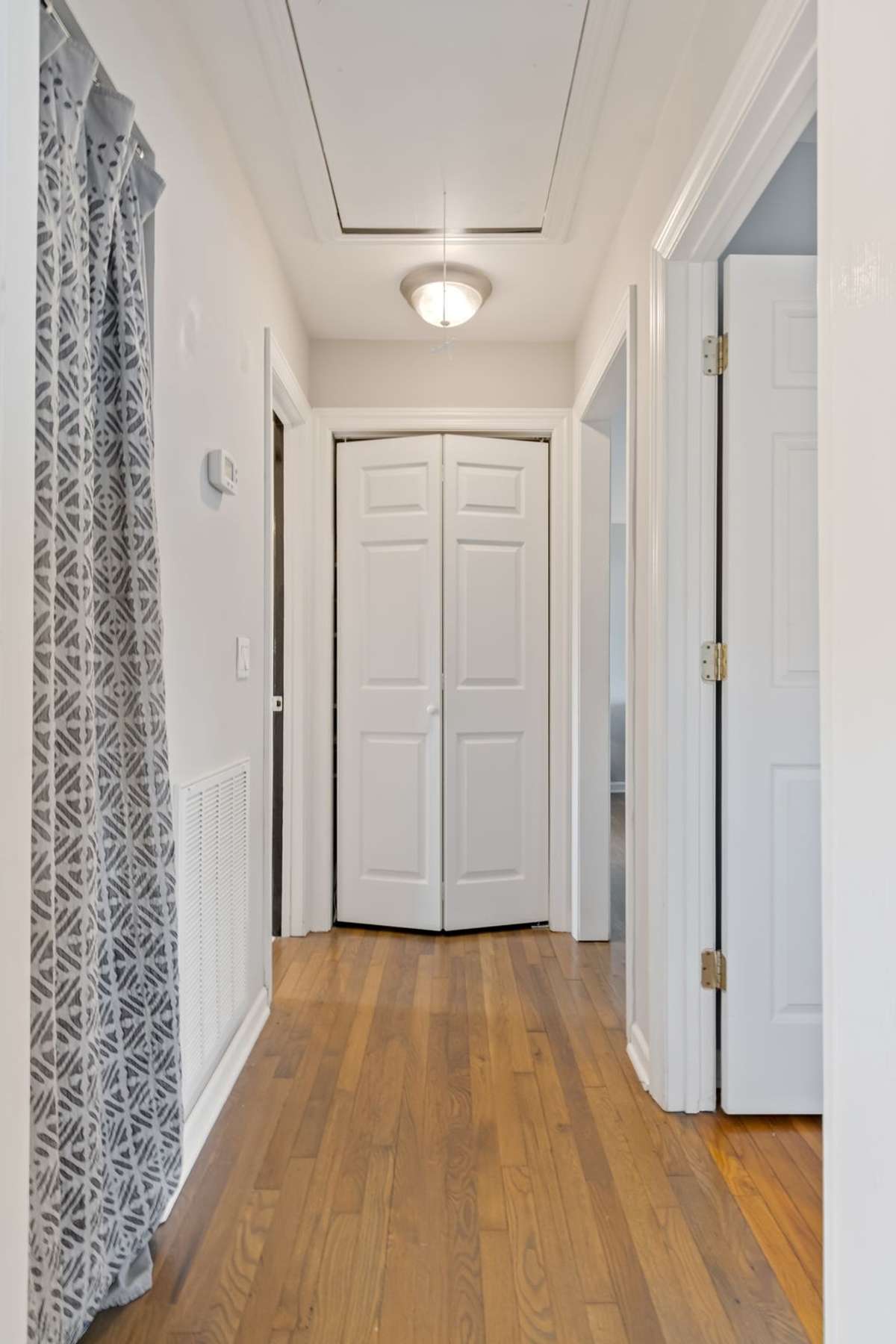 Plenty of storage space in the end linen closet. The laundry closet with hookups for an electric stackable washer/dryer, and a large attic with access from the hall ceiling  and space for luggage, seasonal items and more.
