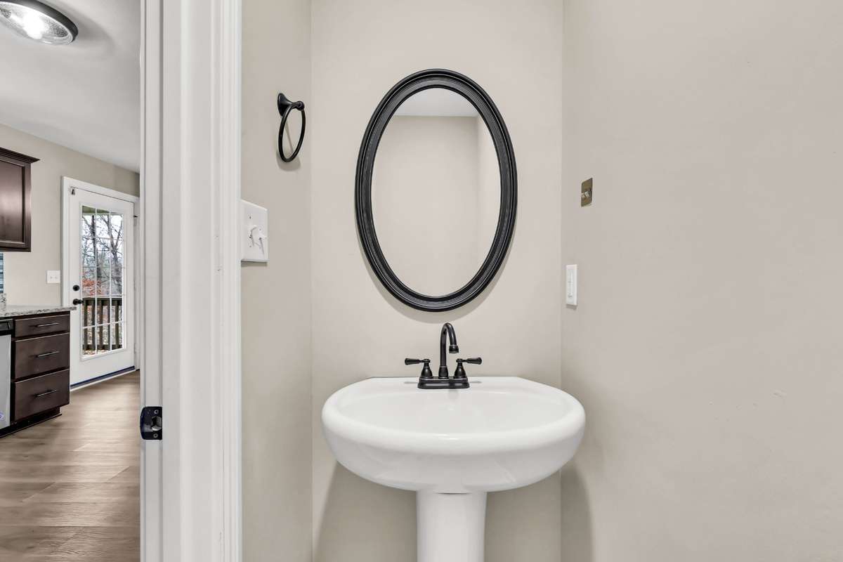 Half bath on main level with tile flooring