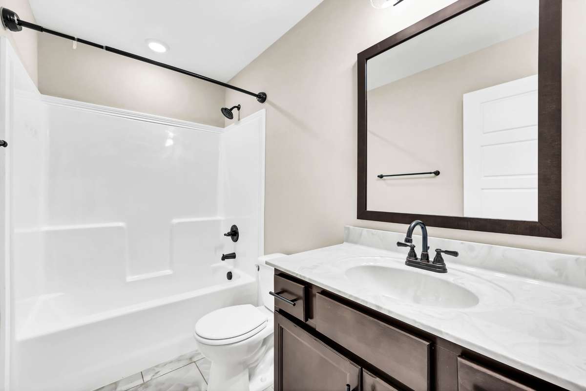 Second full bathroom upstairs with tile flooring