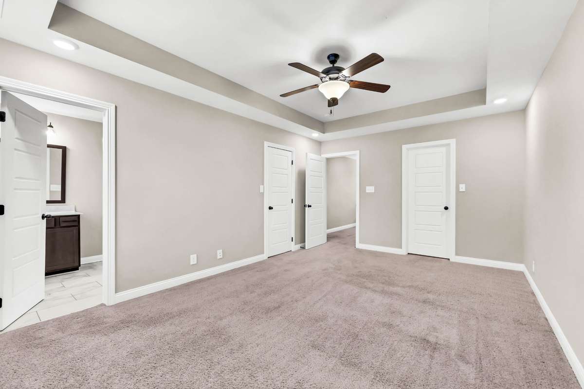 Huge primary suite with two closets and a full bath. Buyer may select flooring, which is on-site.