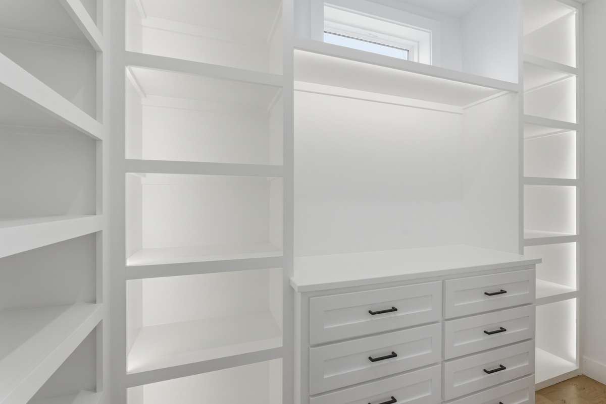 Master Closet: Custom LED-integrated closet lighting elevates both form and function, creating a boutique-style experience with soft, intentional illumination.