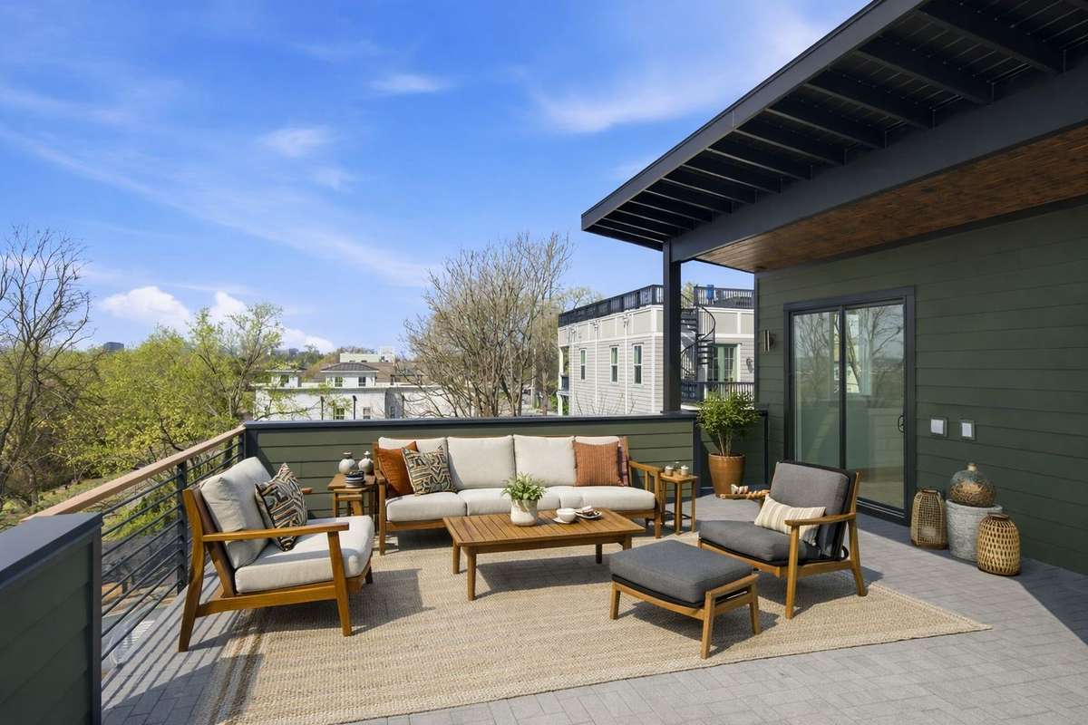 Expansive rooftop deck capturing Shelby Park, the Cumberland River, and downtown Nashville's skyline views, your private outdoor retreat above it all.
