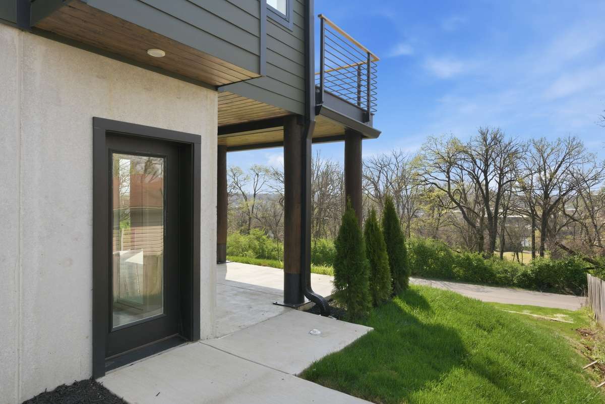 Private access for a lower-level apartment, wellness suite, or game room.
