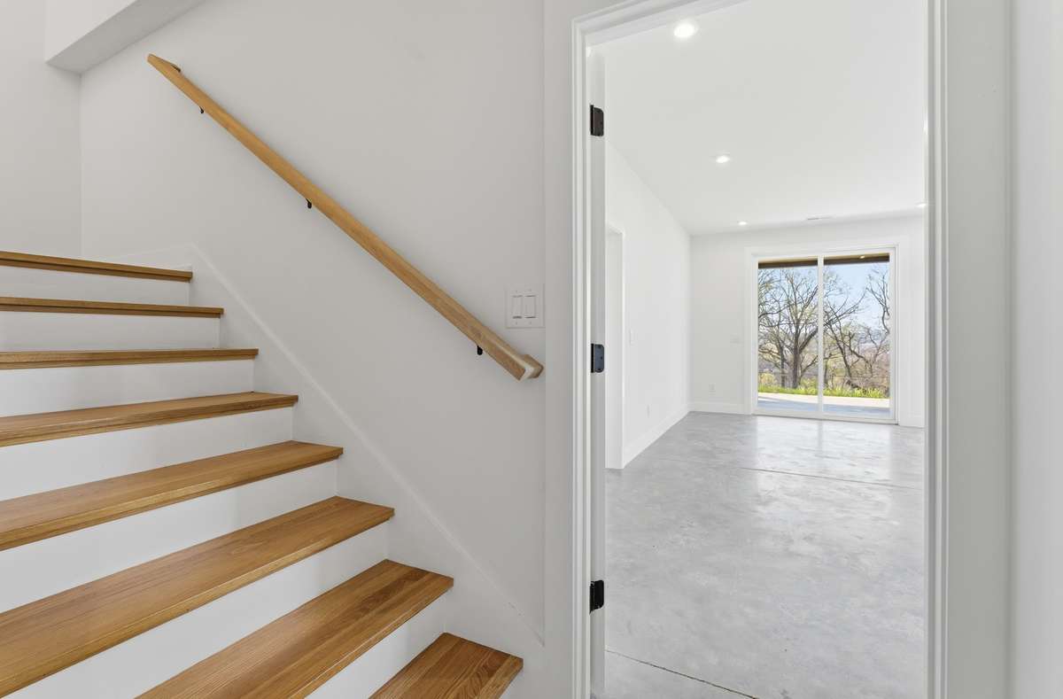 Lower-level bedroom, living room and kitchenette all have interior and exterior access for maximum flexibility.