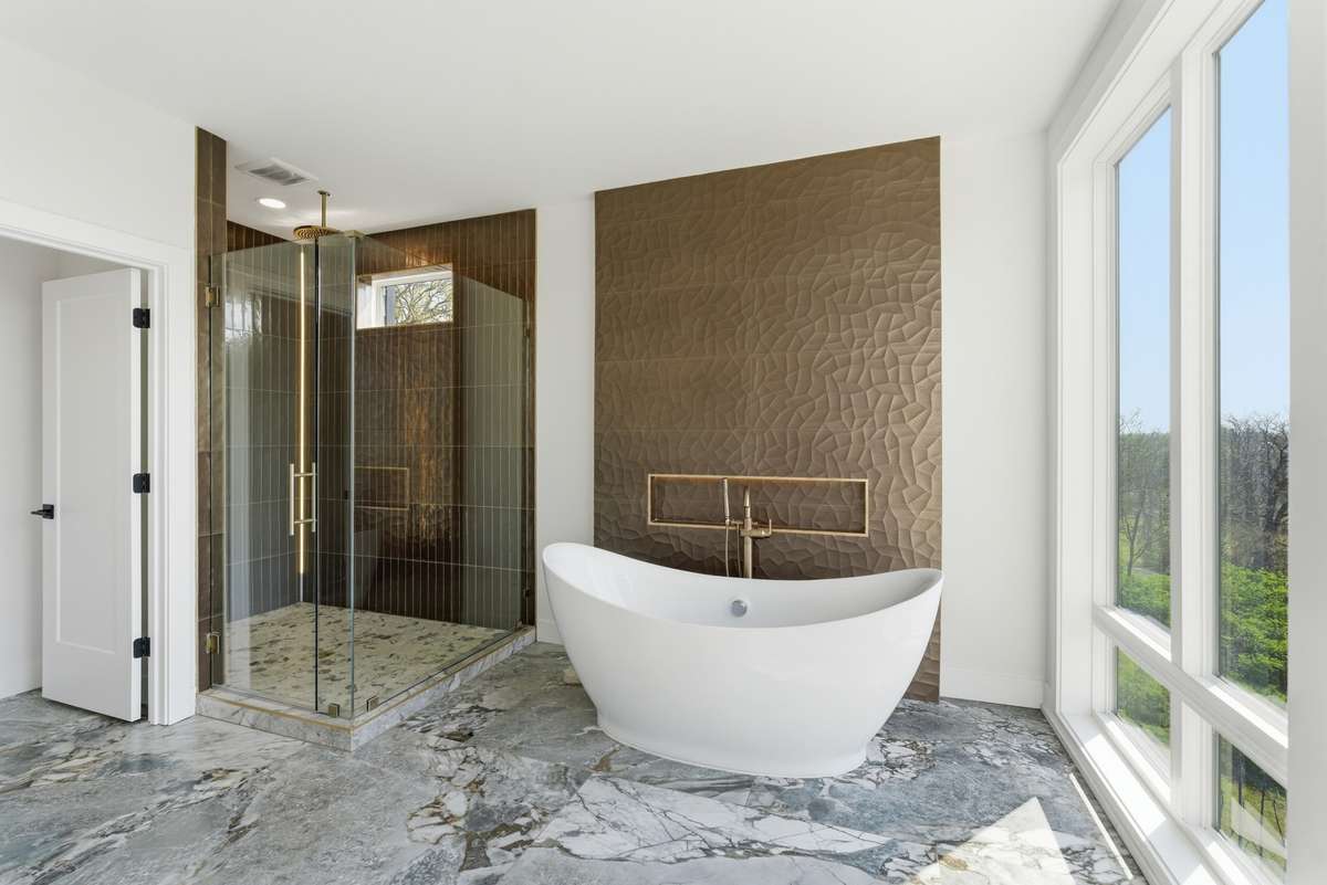 Master Bathroom: spa-like primary bath with soaking tub positioned to capture peaceful views, a true retreat designed for relaxation and daily reset.