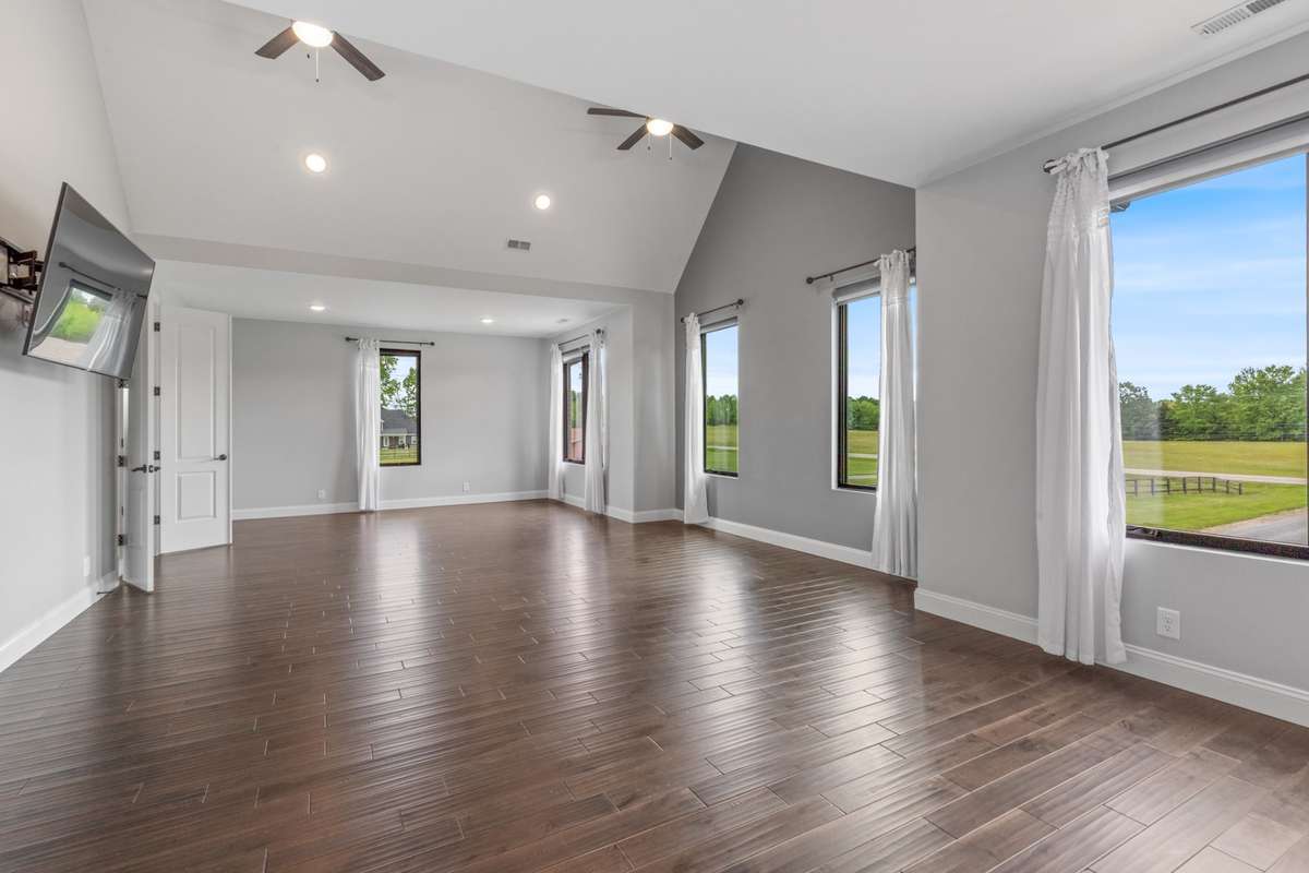 Large owner's suite with tons of natural light and power blinds
