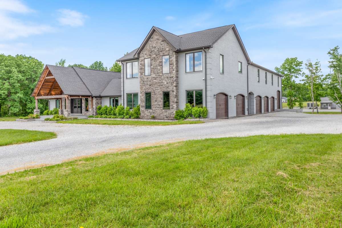 Six car attached garage with one oversized for RV or boat