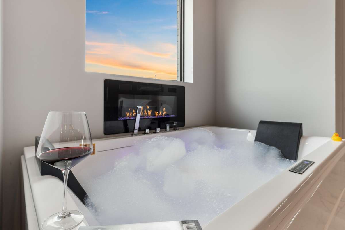 Two person tub with jets, lights, radio and fireplace