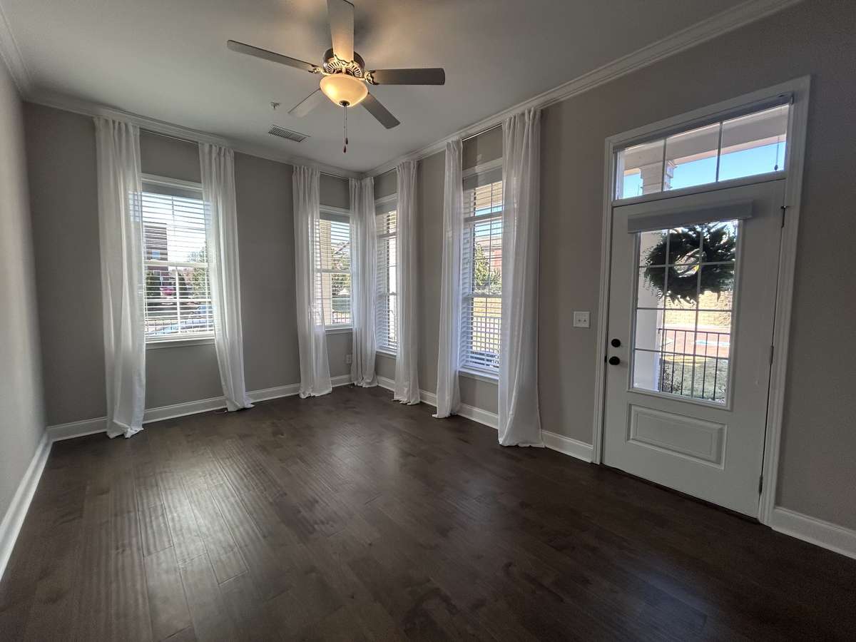Primary Bedroom with entarnce off the private wrap around patio, window treatments are staying.