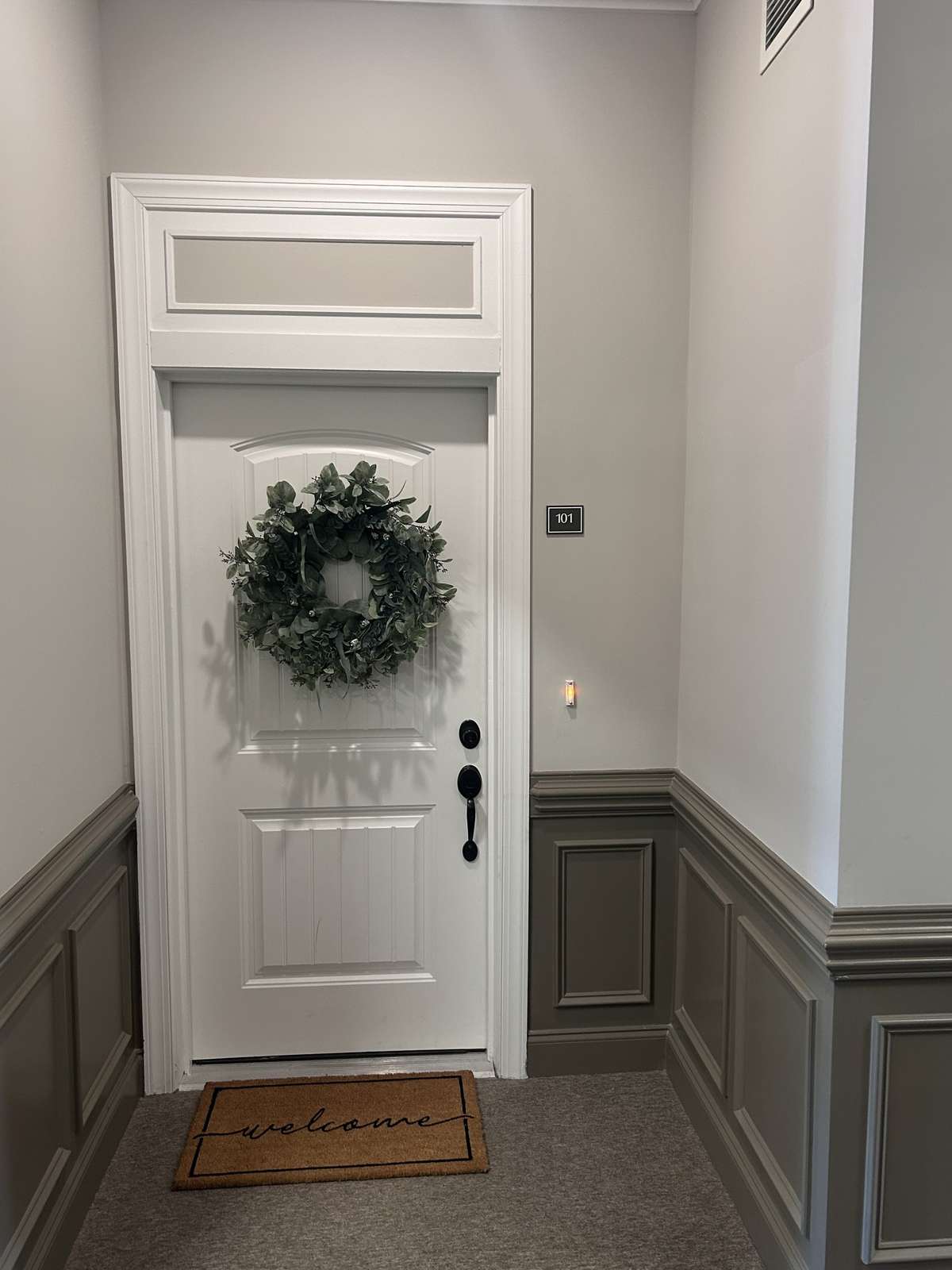 View of front door from interior hall