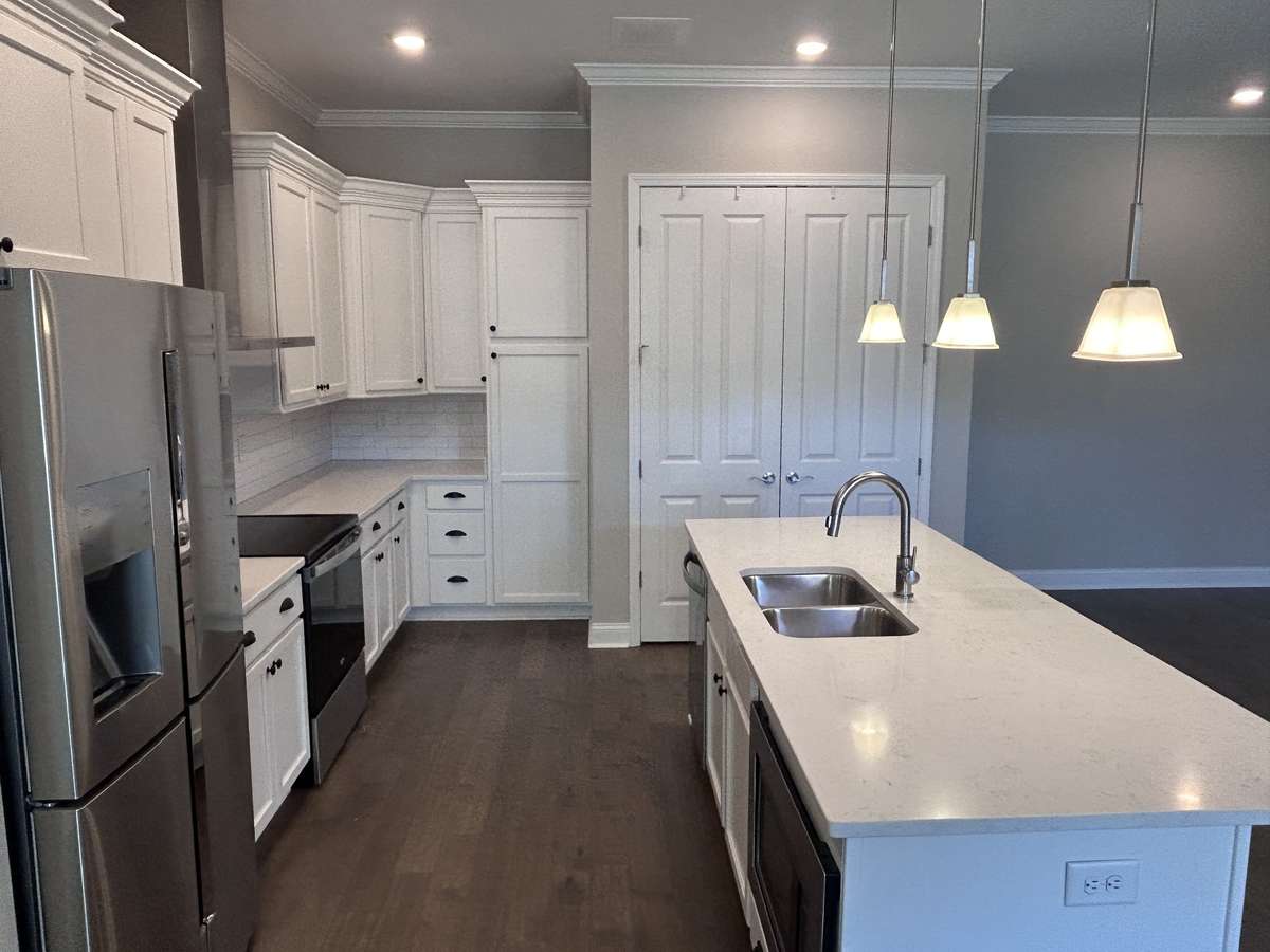 Huge kitchen Island with quartz counter top.