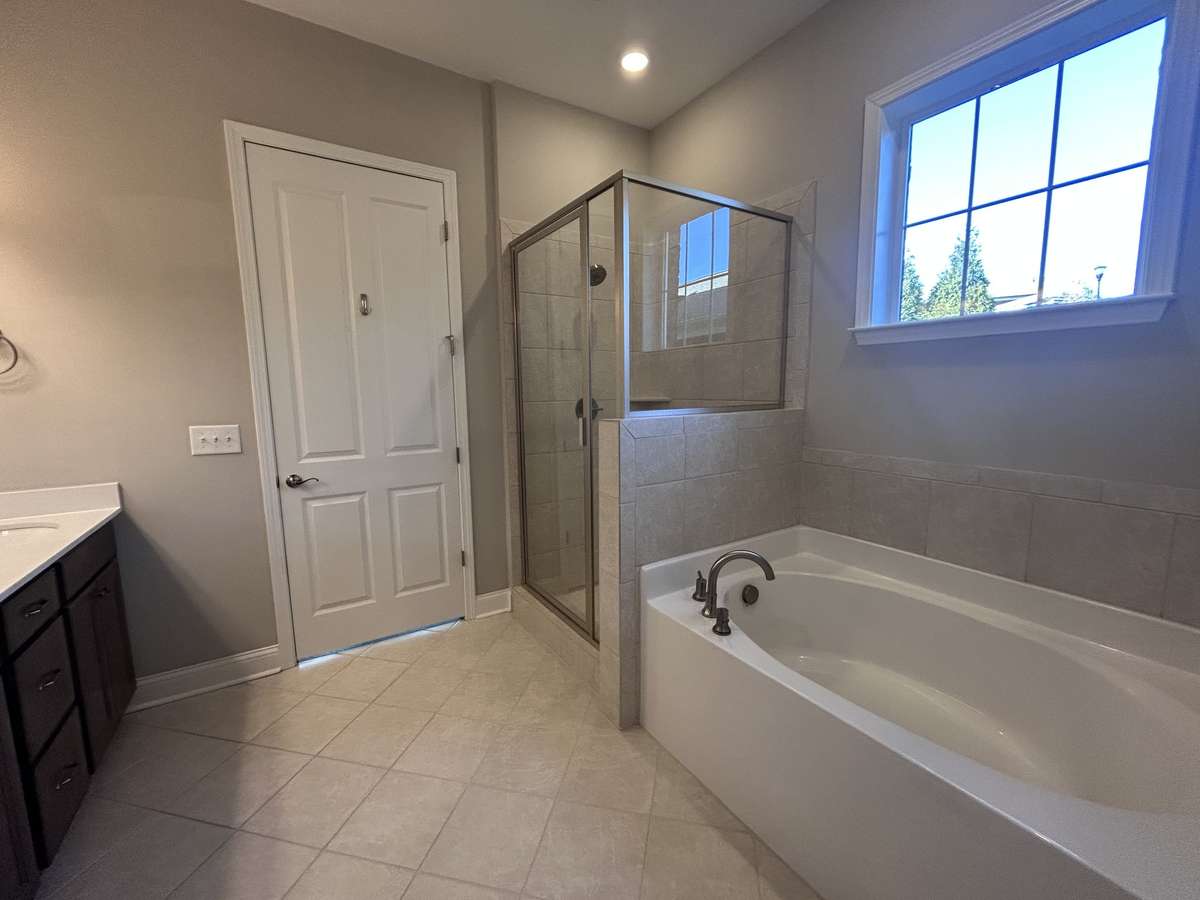 Beautiful Primary bath with tile shower and garden soaking tub