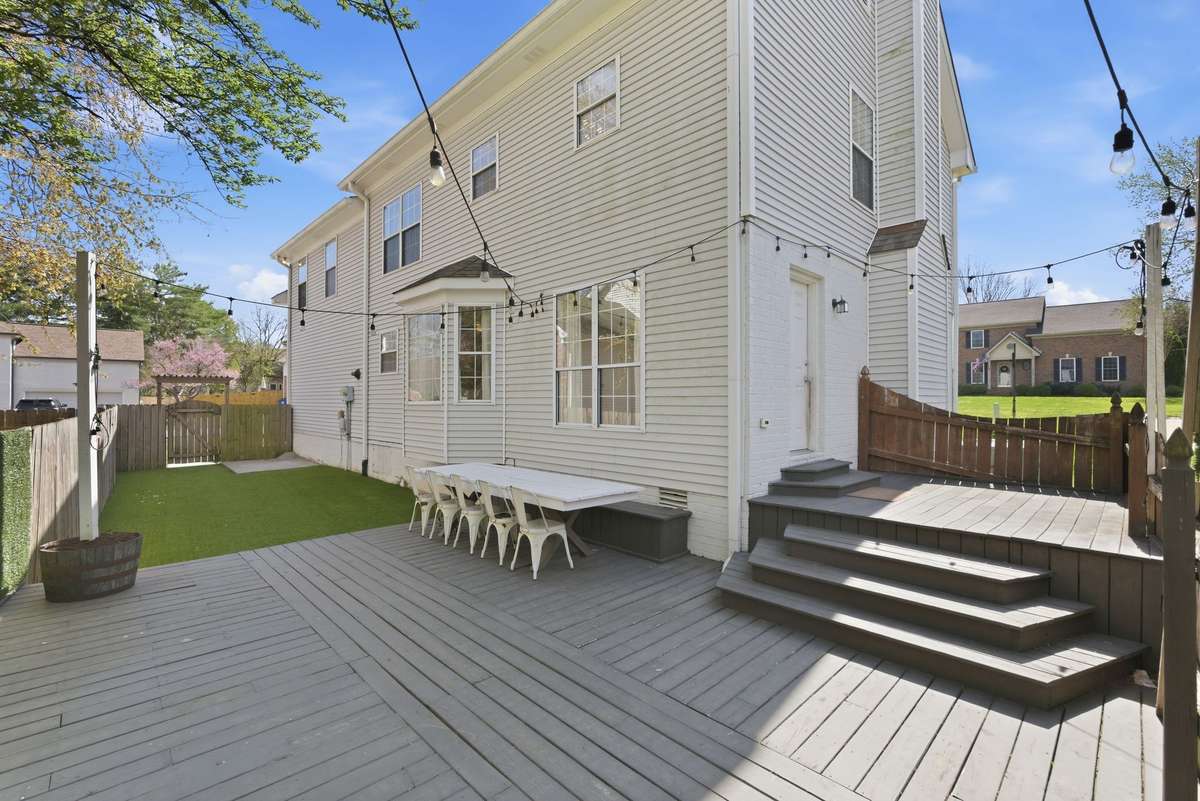 Fenced in back yard with new turf and entertaining area!