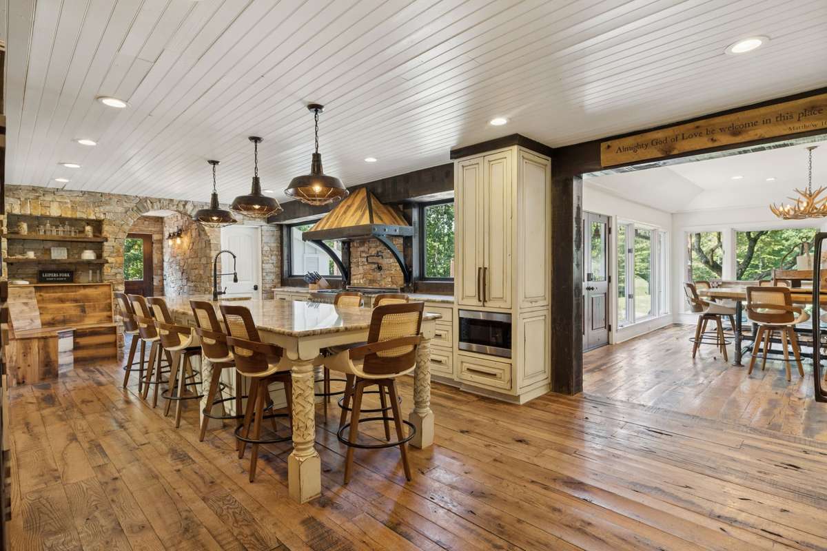 Family kitchen with large sit down bar for the entire family to enjoy meals.
