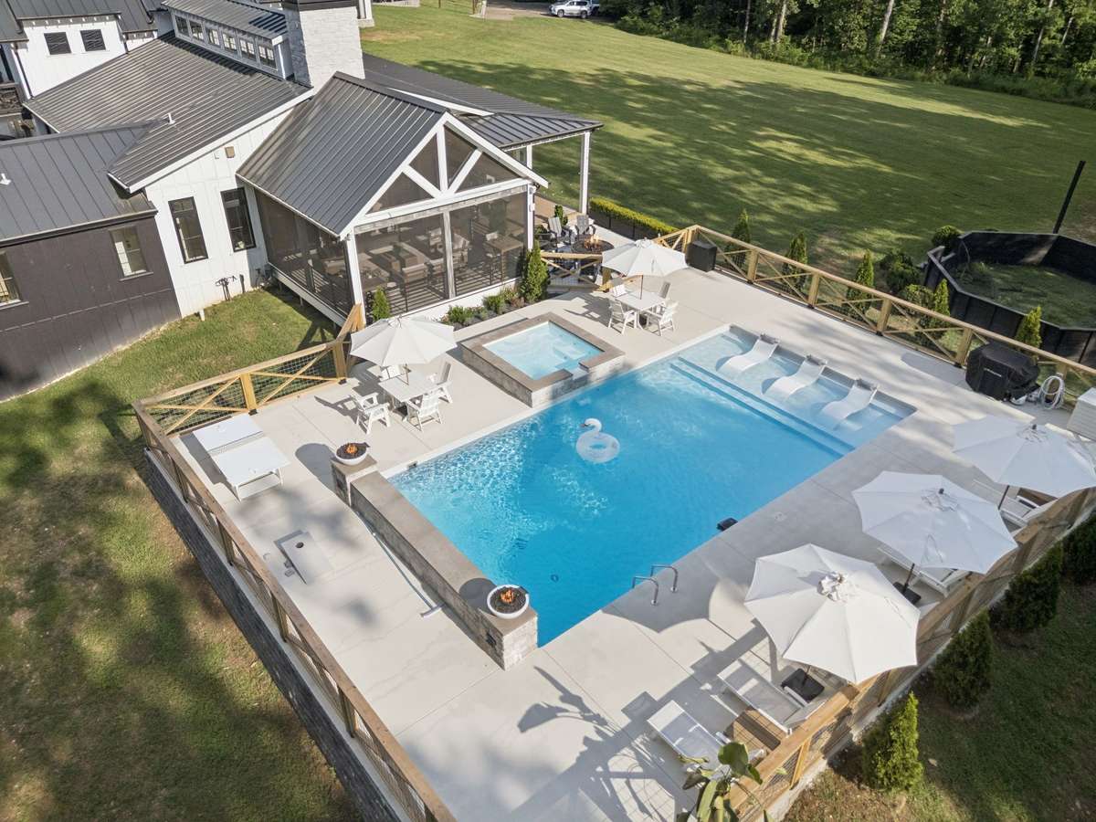 Another view of the swimming pool and adjacent green space!