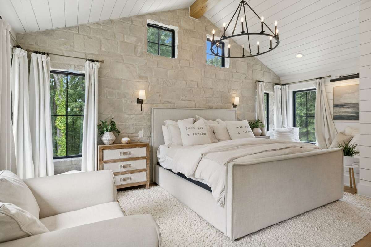 Master Bathroom with raised ceiling and rock accent wall!