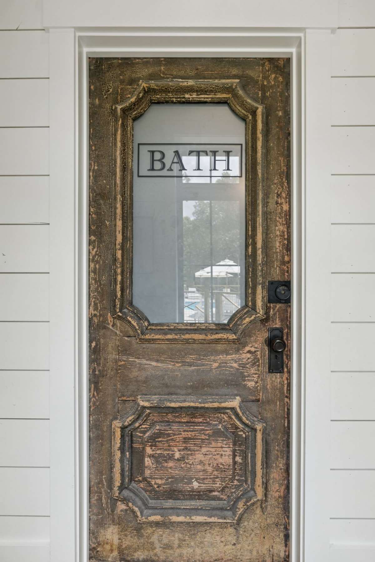 Repurposed antique door for half bathroom on main level.