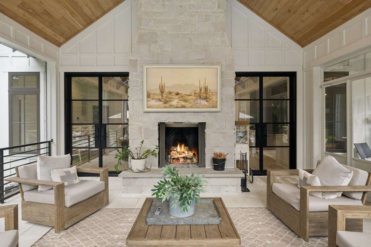 Screened porch with fireplace and TV hook-up.  Enjoy family time overlooking the natural beauty of the property.