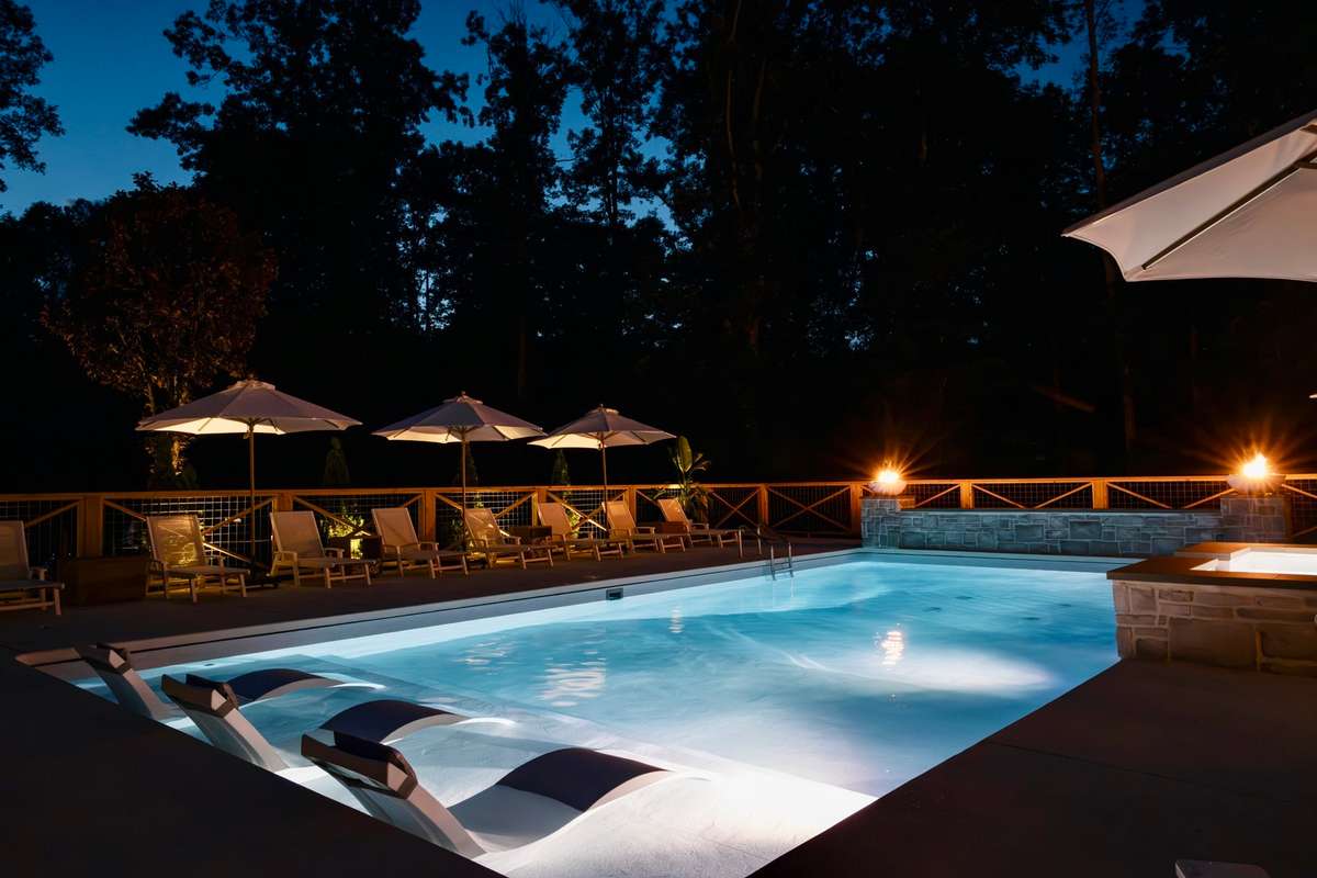 Night time view of swimming pool area.