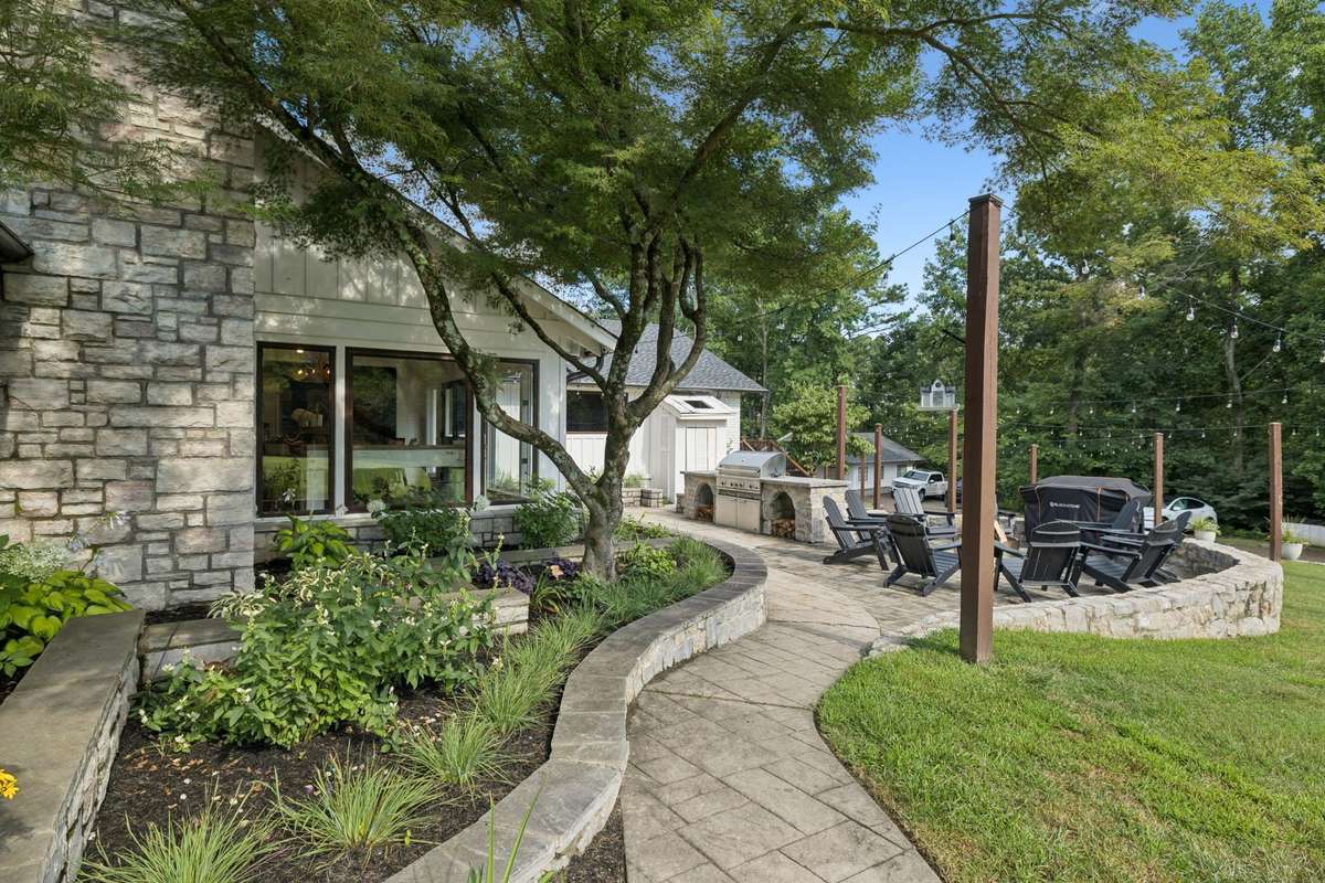 Beautiful flower garden leading to fire pit/outdoor living area 2.