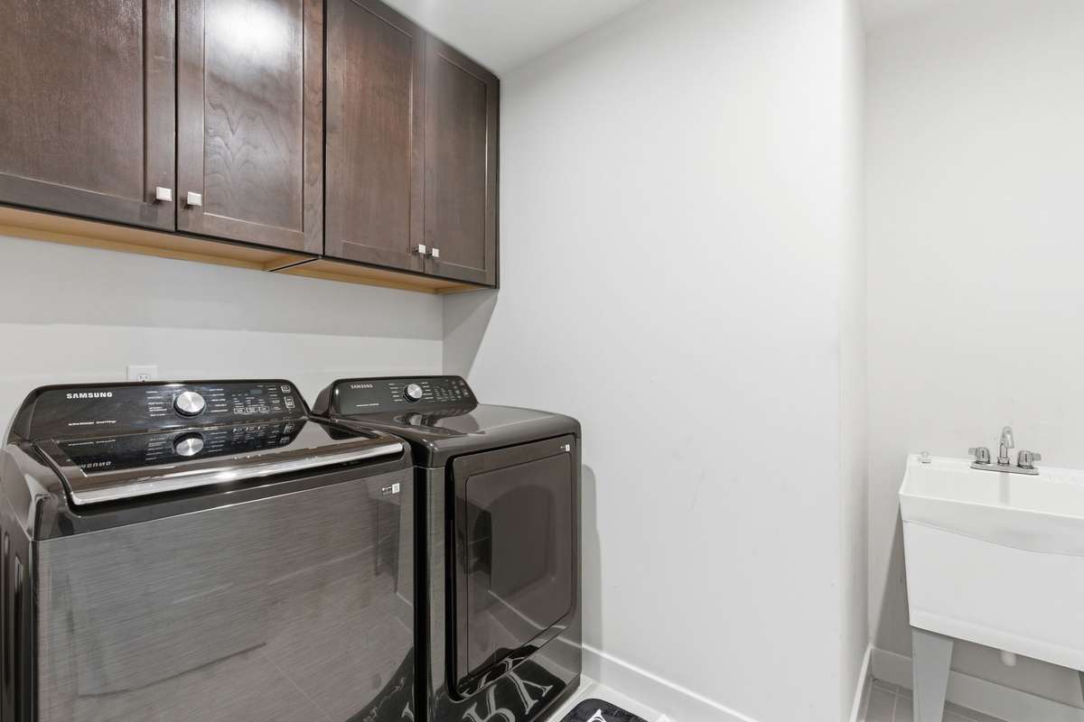 2nd floor laundry room with deep sink