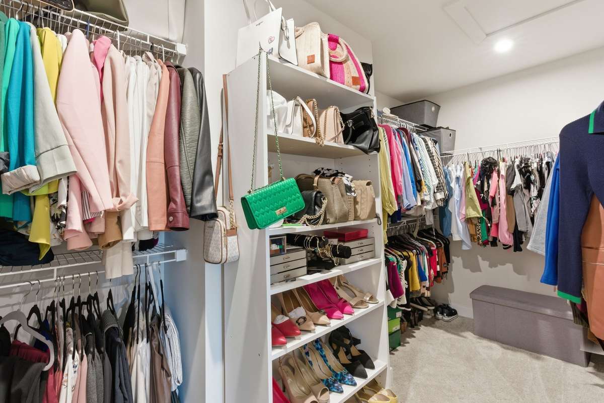 Primary closet (1 of 2 walk-in closets)