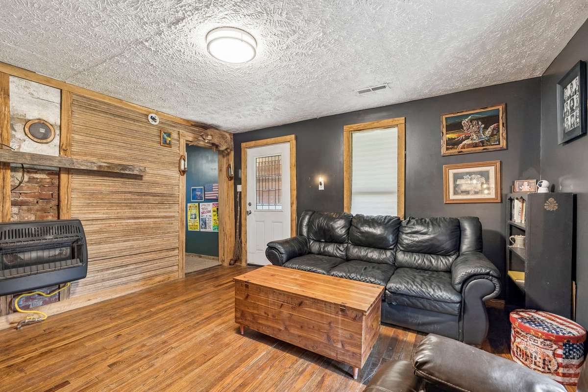 Living room looking towards the front door. Accessory propane heater.