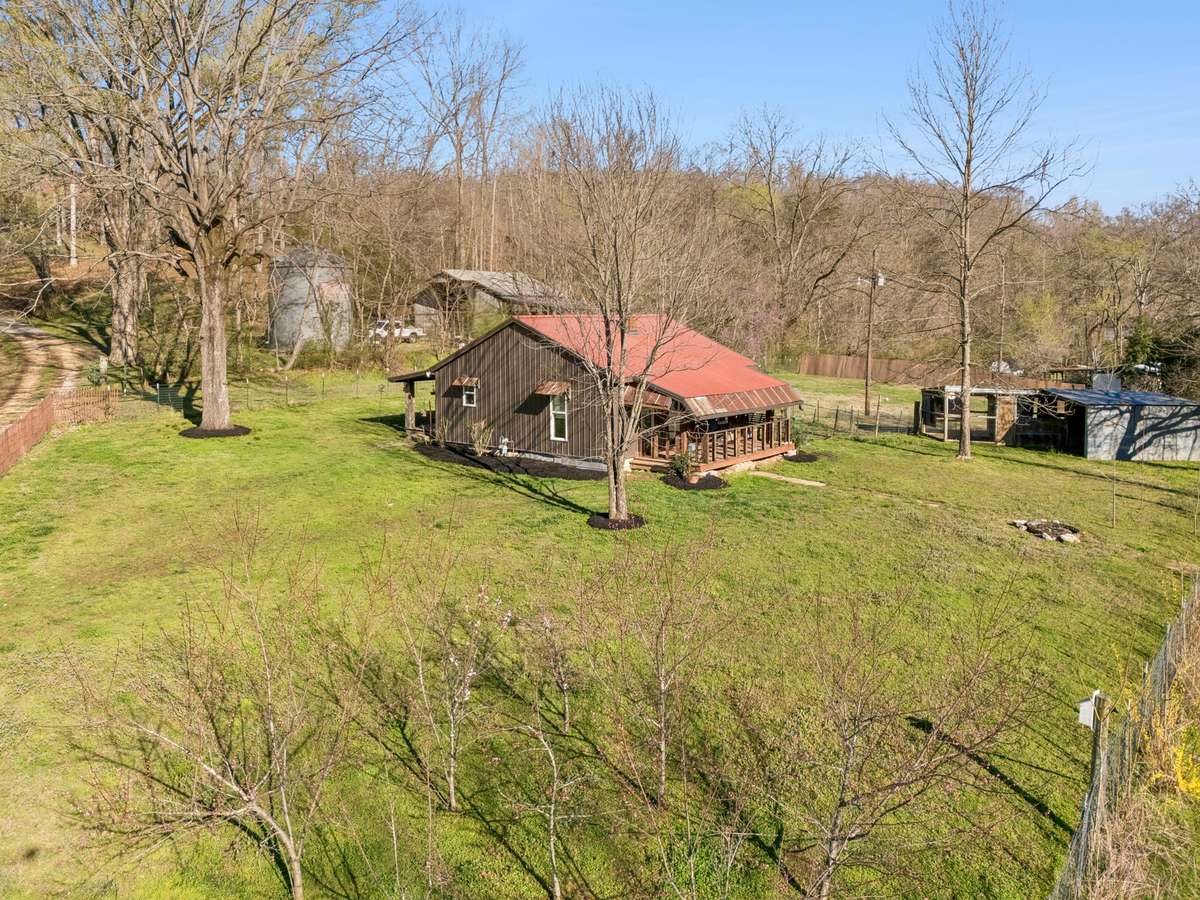 Single family residence home with fully fenced yard on this side of the driveway. Multiple paddocks with outbuildings for the farm animals. Fruit trees planted 2-3 years ago.
