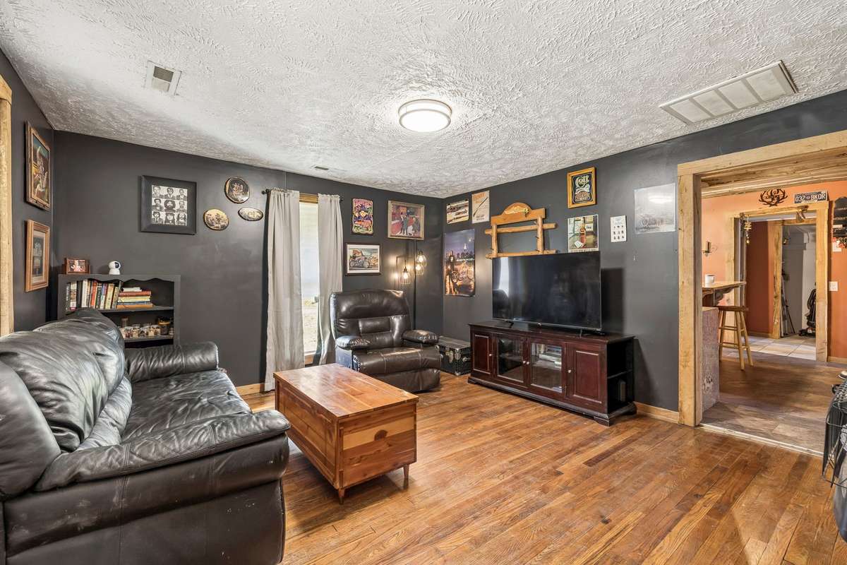 Living room as you enter the front door. Hardwood floors.