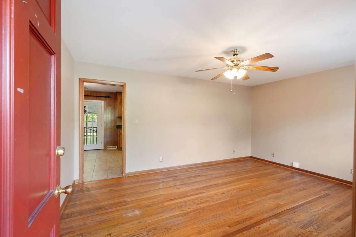 Come into the Living Room of the home with all the real hardwood flooring and natural light