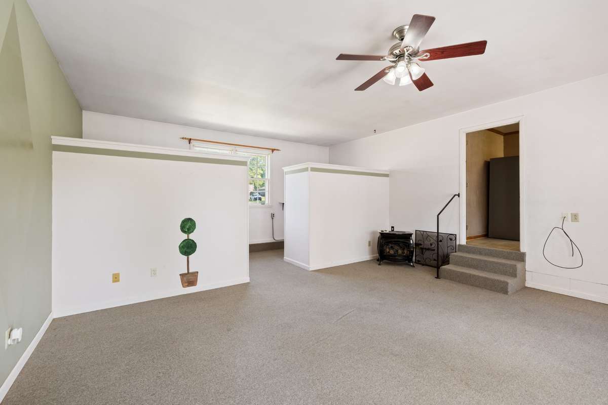 Den Area Off the Kitchen  There is a laundry area  here also.  Large room that was converted from a garage