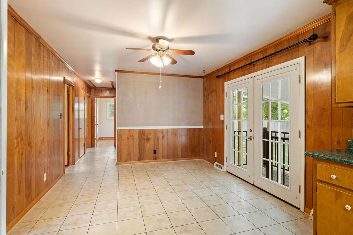 View of Dining Area with Double Doors going onto Screened Porch