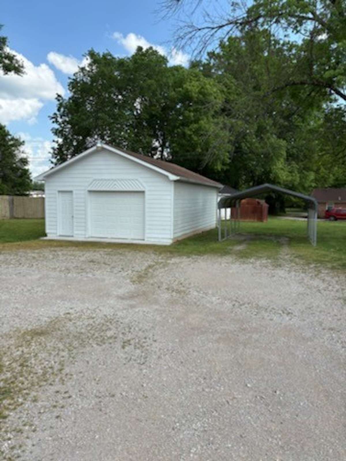 One Car Detached garage with lots of storage.  There is also a carport